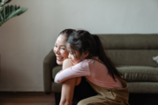 mother and young child hugging