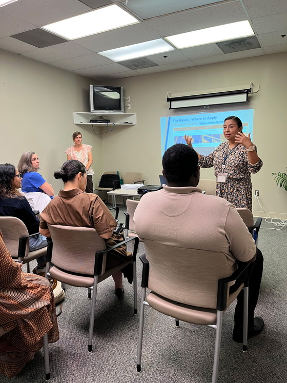 woman presenting to audience