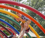 A child plays on a jungle gym at Clemyjontri Park.