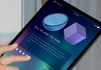 Picture of a person tapping a star rating on a tablet showing colorful feedback form with the words “Tell us what you think."