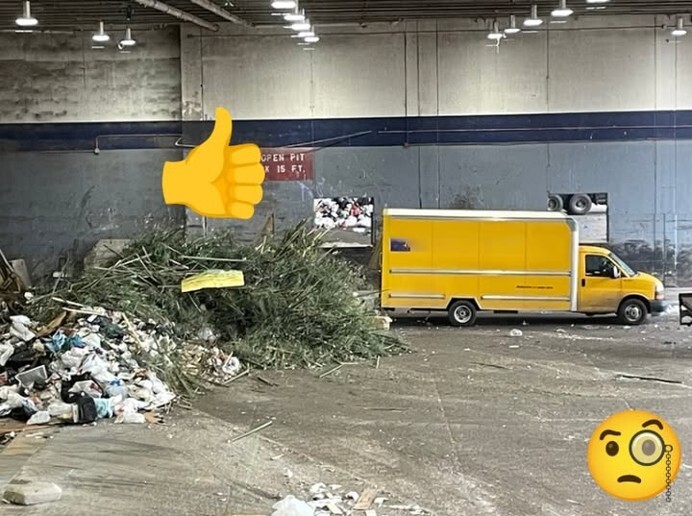 Indoor disposal area with mixed waste piles, a large yellow truck, and added thumbs‑up and puzzled face emojis.