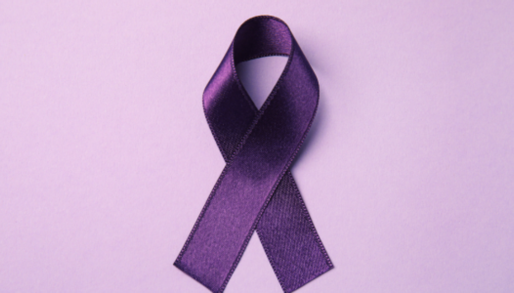 A purple ribbon against a light purple background.