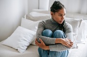 woman upset looking out window