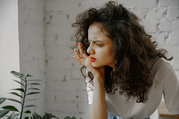 woman upset looking out window
