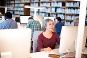 older woman on a public computer