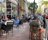 People enjoying sidewalk dining in the historic downtown