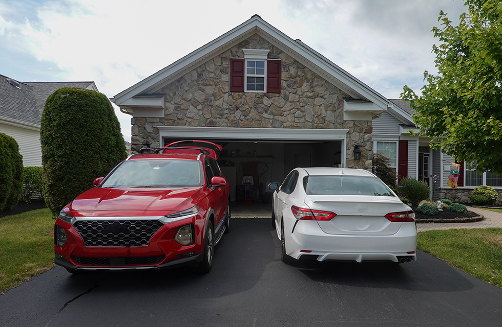 Two cars parked in a driveway