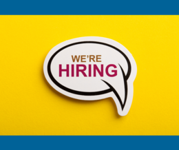White speech bubble that says 'We're Hiring' on a yellow background