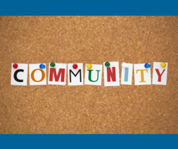 A brown bulletin with nine sticky notes that spells out 'community'
