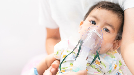 photo of a child receiving respiratory treatment