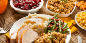 Thanksgiving food spread on a plate and table