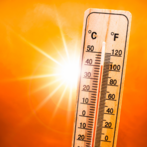 A thermometer showing 100-degree Fahrenheit with a sun in the background. 