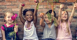 kids holding up fresh food