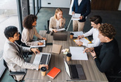 A group of people in a meeting