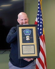 Shawn Burke displays shadowbox gift