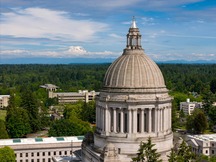 Washington state capitol building with Mount Rainier in background.