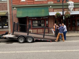 Crews unloading parklet from truck