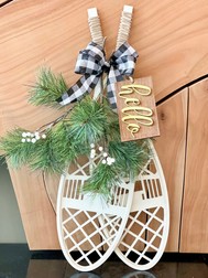 wooden snowshoe hanging
