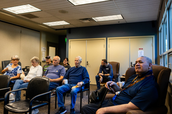 A group of senior citizens at coffee hour at the Auburn Senior Activity Center