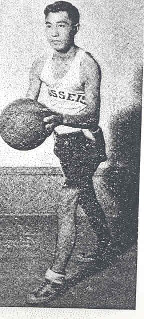 George Yamada c. 1938, posing in his basketball jersey for the local all-Japanese team the White River Bussei.