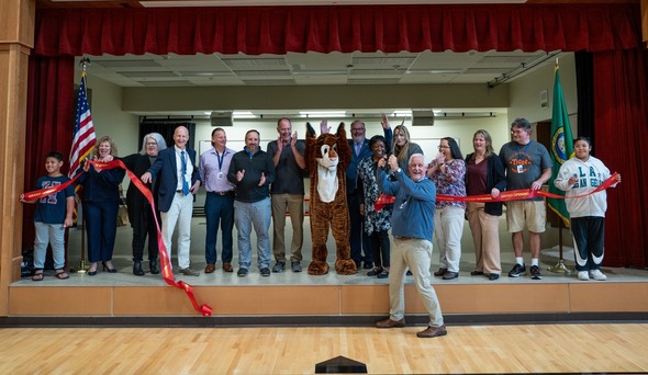 Mayor Backus and others on stage cutting a ribbon for Terminal Park