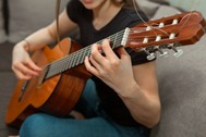 Woman playing guitar