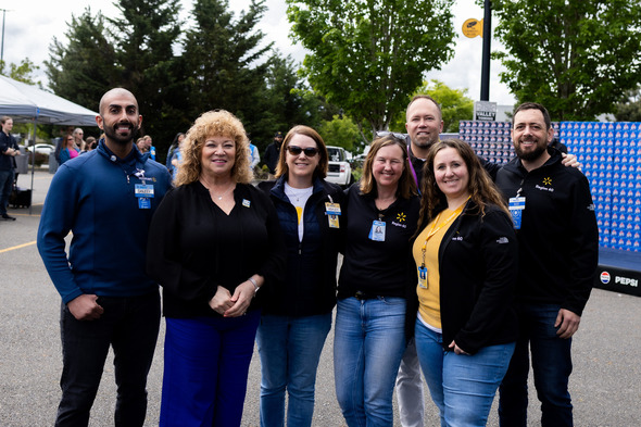 A group photo of Mayor Backus alongside Walmart leadership