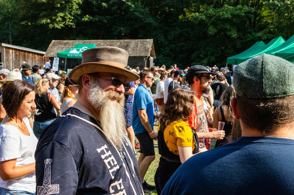 A man in a cool hat sporting a beard at Hops n' Crops