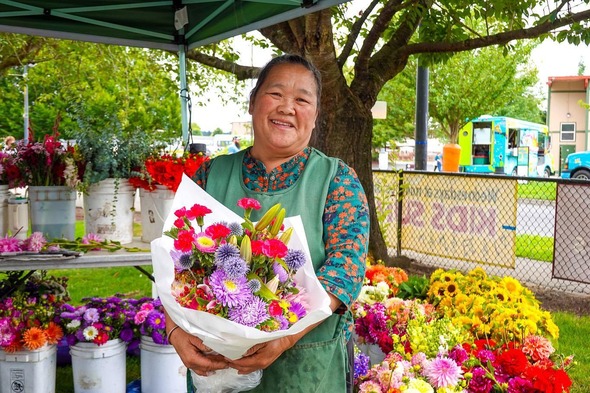 Dao, owner of Dao Lee Garden and florist at the Auburn Farmers Market at Les Gove Park