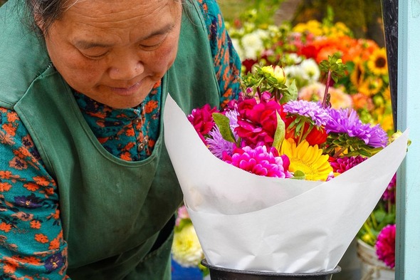 Dao, owner of Dao Lee Garden and florist at the Auburn Farmers Market at Les Gove Park