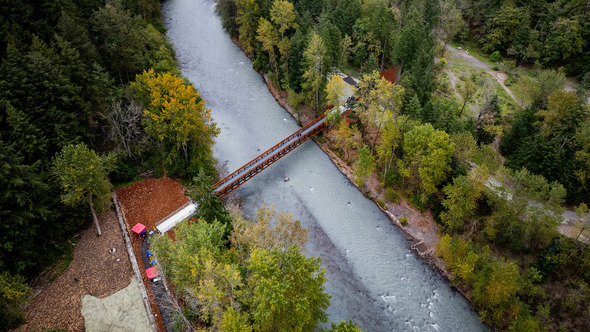 A drone photo of a bridge over White River connecting Game Farm and Game Farm Wilderness Park