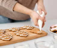 Piping icing on cookies