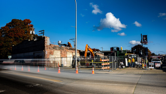 Vehicles passing by as the Auburn Avenue Theater is demolished