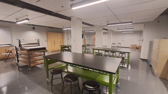 A room with tables and chairs 