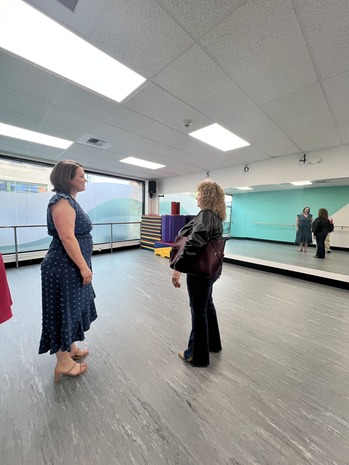 Two women standing in a room