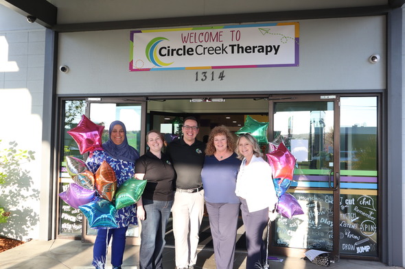 A group of people standing in front of a building