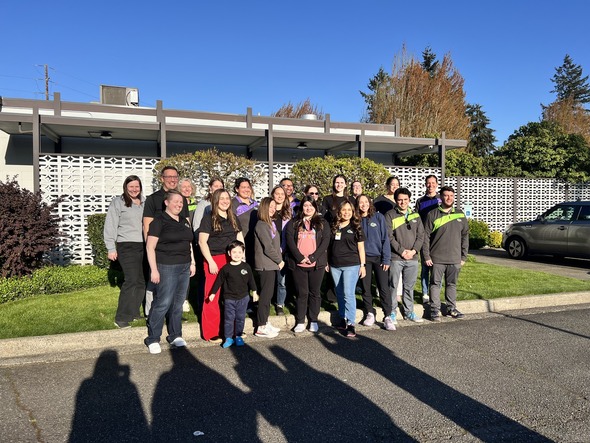 A group of people standing outside of a building