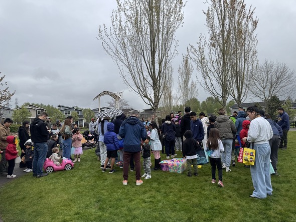 A group of people standing in a park 