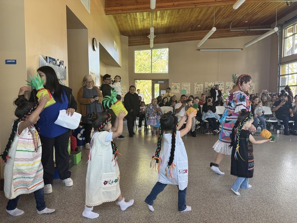 A roomful of kids dancing and having fun