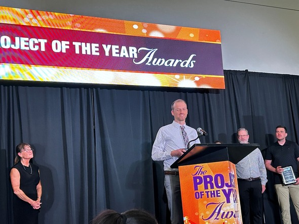 Project Engineer Seth Wickstrom speaks at the APWA Project of the Year Award ceremony.
