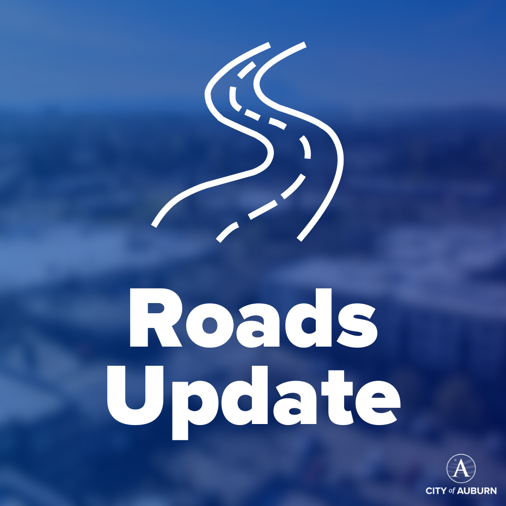 A graphic that says Roads Update over a blue background