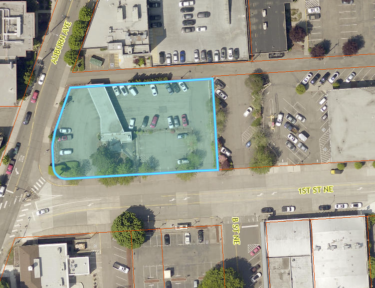 Aerial view of Wells Fargo parking lot at Auburn Ave and 1st St NE, highlighted for temporary City staff parking.