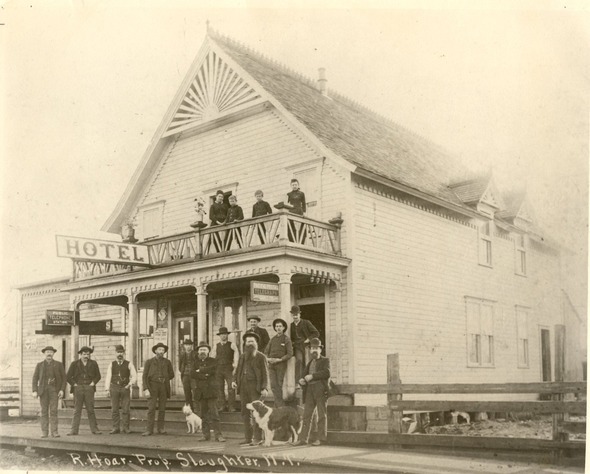 1800s photo of people and dogs outside the Hotel in Slaughter, Washington (now Auburn).