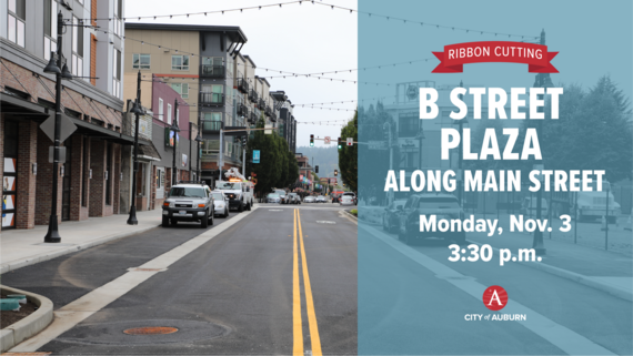 Downtown Auburn’s newly improved Main Street with string lights above and cars parked along the curb.