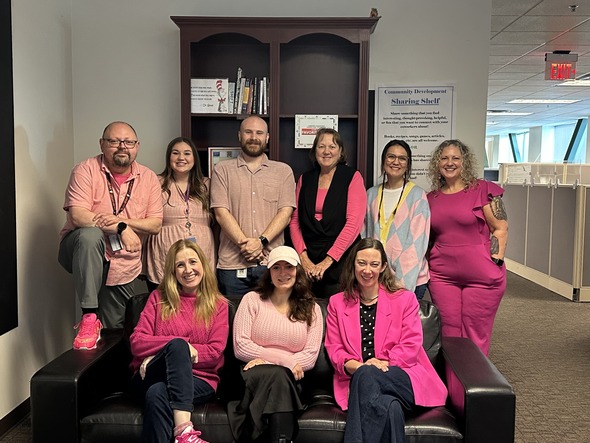 City staff wear pink for Breast Cancer Awareness Month inside the Community Development office.