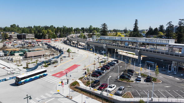 Aerial view of the new Federal Way Link station, bus loop, parking areas, and ongoing construction.