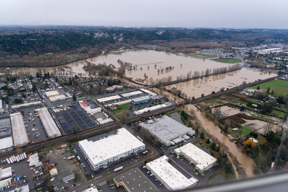 Aerial view of widespread flooding along the Green River impacting neighborhoods and open land.