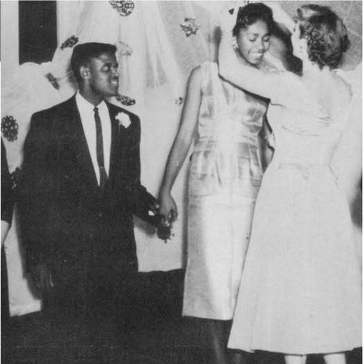 A man and a woman at a dance. the photo is in black and white