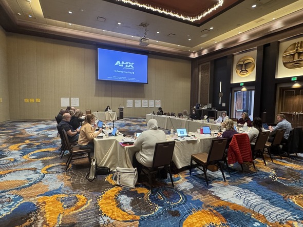 City council and directors seated in a U-shaped layout during a budget leadership retreat in a large conference room.