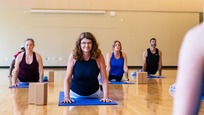 group of people enjoying a yoga fitness class